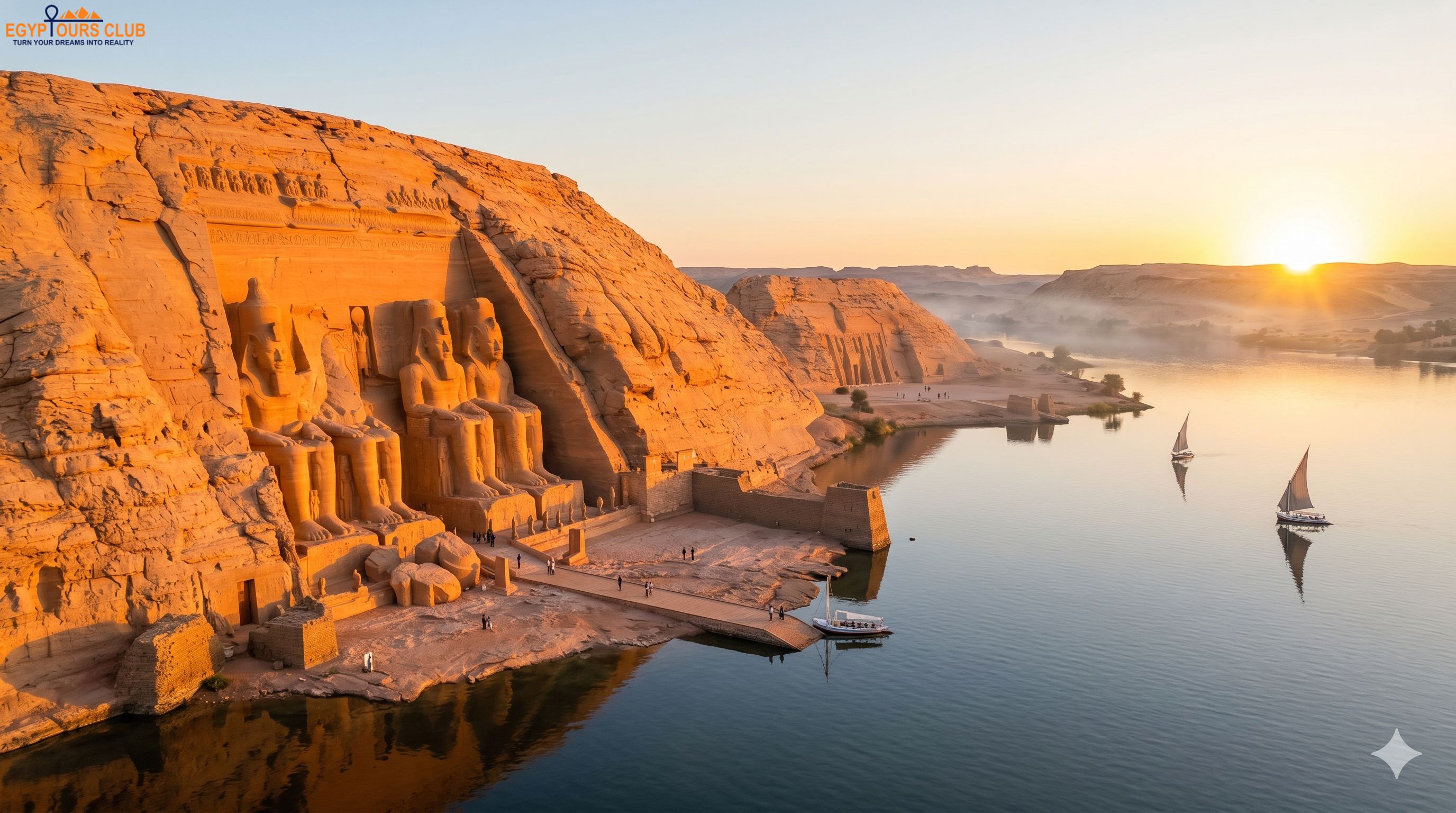Abu Simbel temple façade at sunrise during a day trip from Aswan